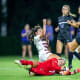 Lauren Kellett (1) makes a diving save in traffic.